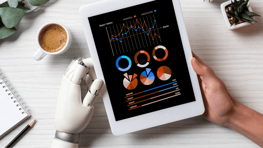 Robot and human hands holding a tablet displaying business analytics charts, symbolizing AI-human collaboration in MSP sales strategy.